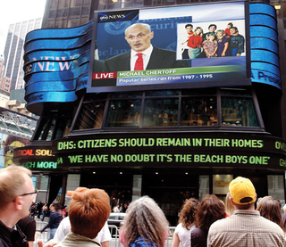 Passersby await the latest <i>Full House</i> updates in New York's Times Square Tuesday.